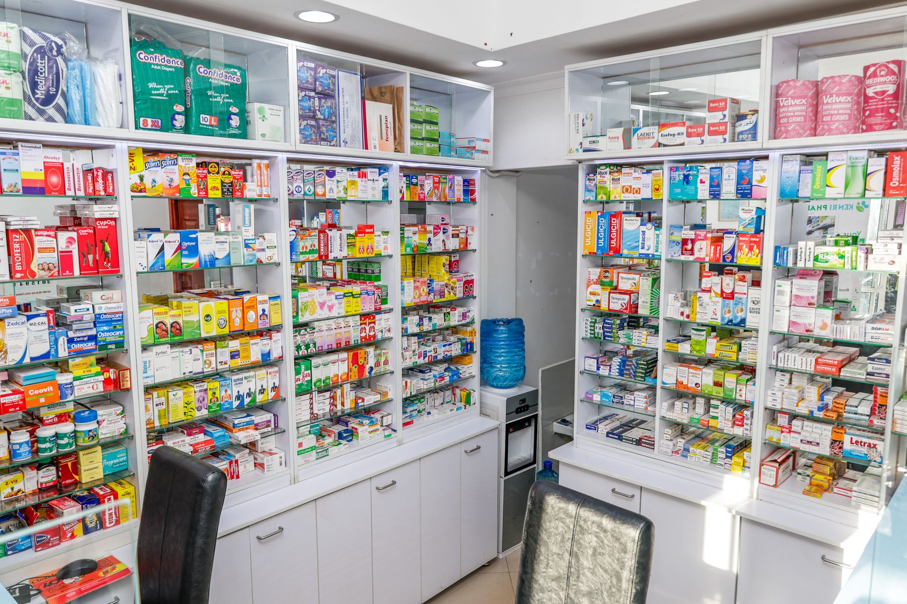 Kenri Pharmacy Ngong interior — full room view of display shelving and dispensing area, fit-out by Butterfly Interiors