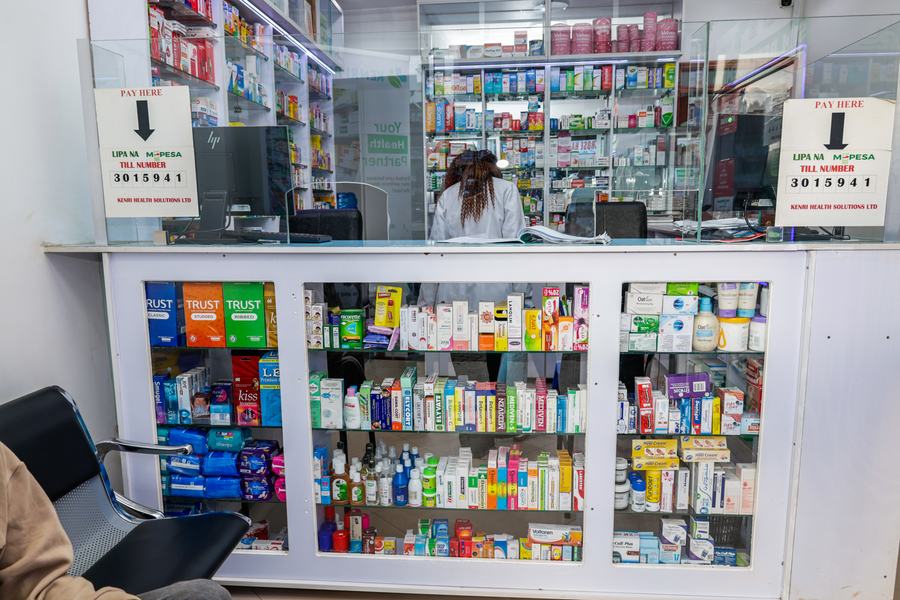 Customer service counter with glazed screen and under-counter product display, Kenri Pharmacy Ngong