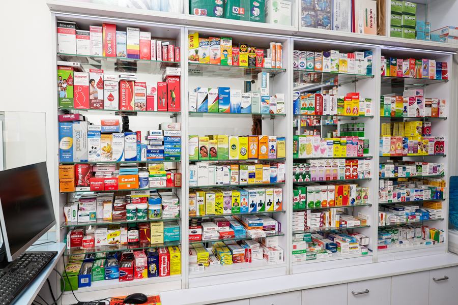 Pharmacy wall display joinery with base storage cabinets, Kenri Pharmacy Ngong