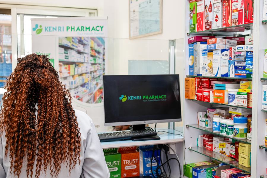 Pharmacist workstation and branded display at Kenri Pharmacy, Ngong