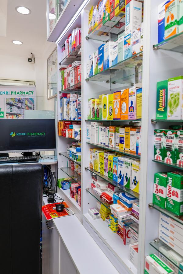 Detail of glass-shelf product display joinery, Kenri Pharmacy Ngong